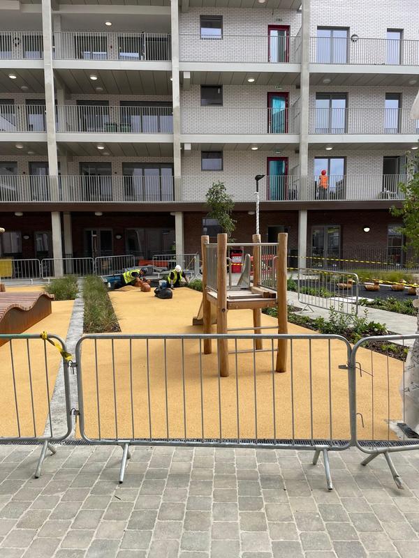 Fenced play area — rubber crumb project by National Surfacing