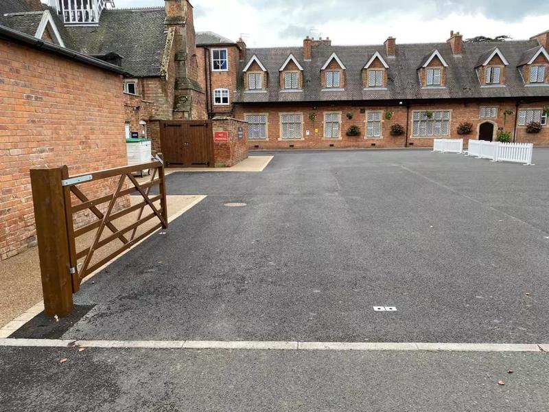 Tarmac courtyard in front of a period building